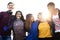 Group of school friends outdoors arms around one another togetherness and community concept