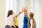 Group of school kids making high five gesture