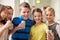 Group of school kids with smartphone and soda cans