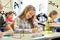 Group of school kids writing test in classroom