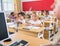 Group of school pupils raise their hands up