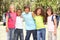 Group Of Schoolchildren Standing In Park