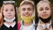 Group of schoolchildren taking off medical masks and smiling