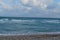 Group of seagulls looking for food flying over the ocean and beaches