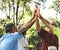 Group of senior athletes giving a high five