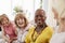 Group Of Senior Female Friends Relaxing On Sofa At Home