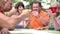 Group Of Senior Friends Enjoying Cocktails In Bar Together