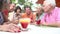 Group Of Senior Friends Enjoying Cocktails In Bar Together