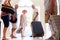 Group Of Senior Friends Standing By Front Door With Luggage About To Leave For Vacation