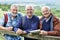 Group Of Senior Male Friends Hiking In Countryside