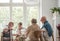 Group of senior sitting together at nursing home dining room