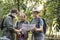 Group of senior trekkers checking a map for direction