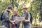 Group of senior trekkers checking a map for direction