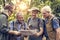 Group of senior trekkers checking a map for direction