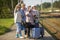 Group of senior women take a self-portrait on a platform waiting for train to travel during a COVID-19 pandemic