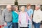 Group of seniors in conversation with geriatric nurse