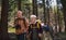 Group of seniors hikers outdoors in forest in nature, walking.