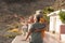 Group of seniors and mature people at the beach looking the sea or the ocean hugged and one of they is indicating something