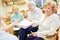 Group of seniors in a nursing home undergoing painting therapy