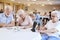 Group Of Seniors Playing Game Of Bingo In Retirement Home