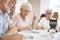 Group Of Seniors Playing Game Of Bingo In Retirement Home