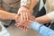 Group of seniors putting their hands together. Stack of hands showing supporting each other