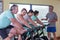 Group of seniors using spinning bikes