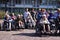 Group of seniors in wheelchairs in front of a house for the elderly in Holland