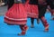 Group of Serbian folk dancers in an outdoor festival.