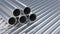 Group, set of simple new high quality shiny galvanized stainless steel metal aluminium alloy pipes stacked, iron pipes, industrial