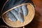 Group set of Sun dried gourami fish on bamboo basket. Salted gourami fish for food preservation is favorite delicious Thai