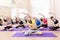 Group of Seven Caucasian Sportive Women Stretching Indoors