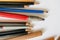 Group of several different graphite artist`s pencils lying on a white background