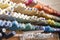 group of sewing threads in skeins. A bunch of large multicolored spools of thread. Atelier workshop. A set of colored
