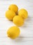 A group of sicilian lemons over wooden table