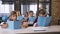 Group of six Caucasian high school pupils sitting at desks independently studying new topic on lesson from classroom