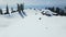 A group of ski touring enthusiasts on top of a snow-covered mountain