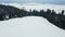 A group of ski touring enthusiasts on top of a snow-covered mountain