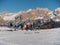 Group of Skiers, adults, teenagers and children ready to face a Descent on the Ski Slope, in the background the Beautiful Italian