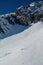 A group of skiers descending on the snowy mountain top on Top of Innsbruck. Nordkette, Innsbruck