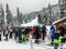 A group of skiers and snowboarders waiting in line to hitch a ride up the ski lift on Cypress Mountain