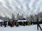 group of skiers and snowboarders waiting in line to hitch a ride up the ski lift on Cypress Mountain