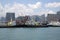 Group skyscrapers and boats in pier Hongkong