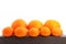 Group of small and big tangerines or mandarin oranges isolated on white