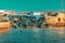 Group of small boats moored in a tranquil body of water in Morocco.