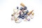 Group of small marine colored blue orange seashells of different shapes on white background. Design