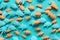 A group of small plastic fish on a blue surface. AI generative image