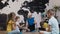 Group of small pupils from five children sitting on floor and listening to teacher. Children and education, young blonde