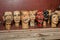 Group of Small Statues of Worn Wooden Heads on a Table