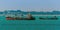 A group of small tankers moored offshore in the Singapore Straits in Asia